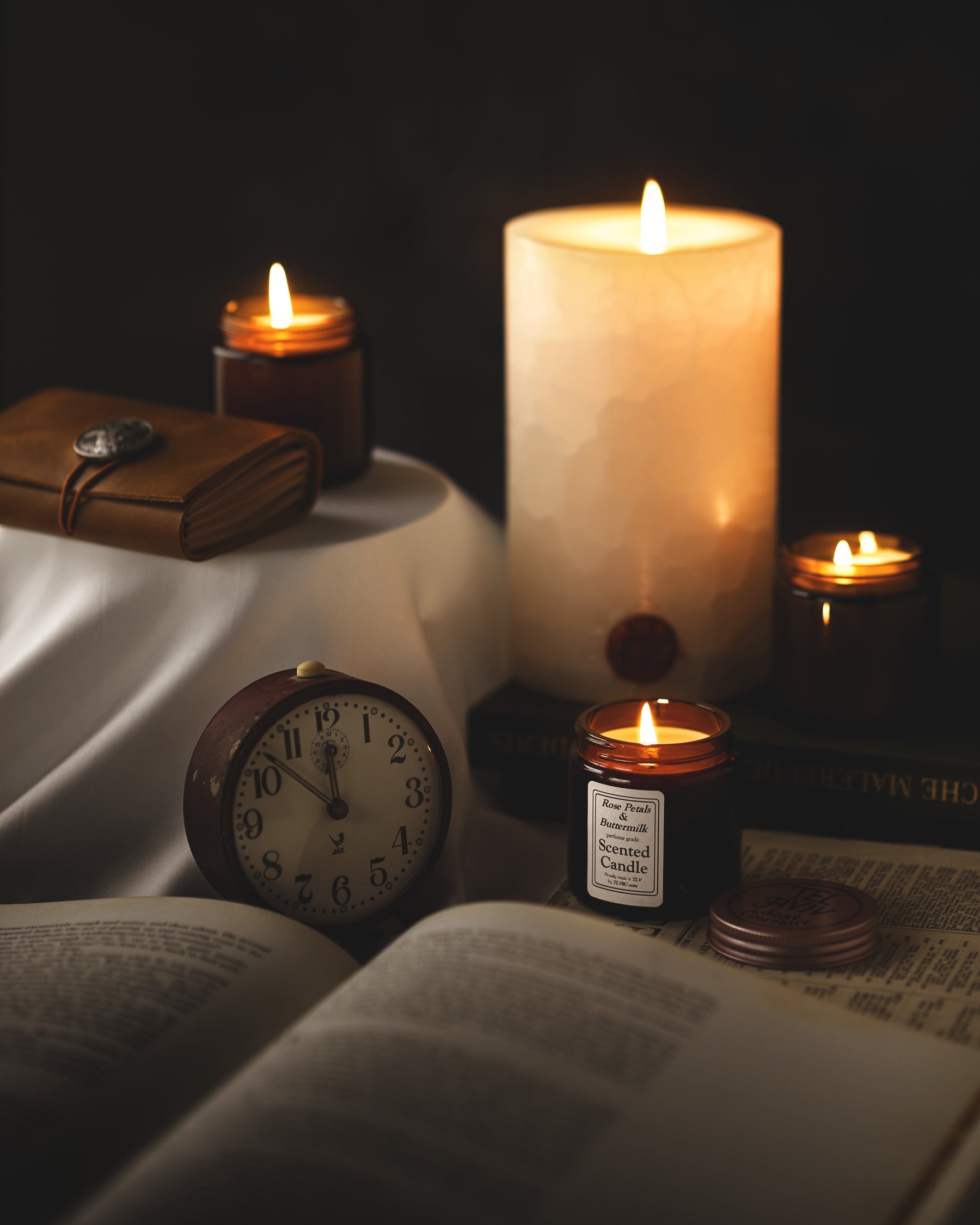 TLVSC candle collection with three small candles and one large candle